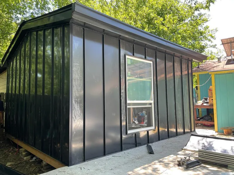 Black standing seam metal wall panels for Roof Inspection in Headland